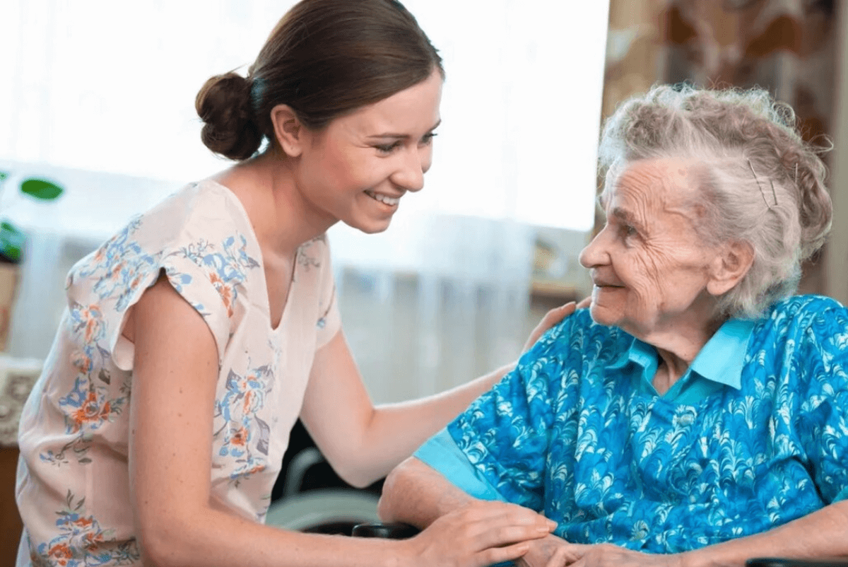 a home care nurse caregiving an elder